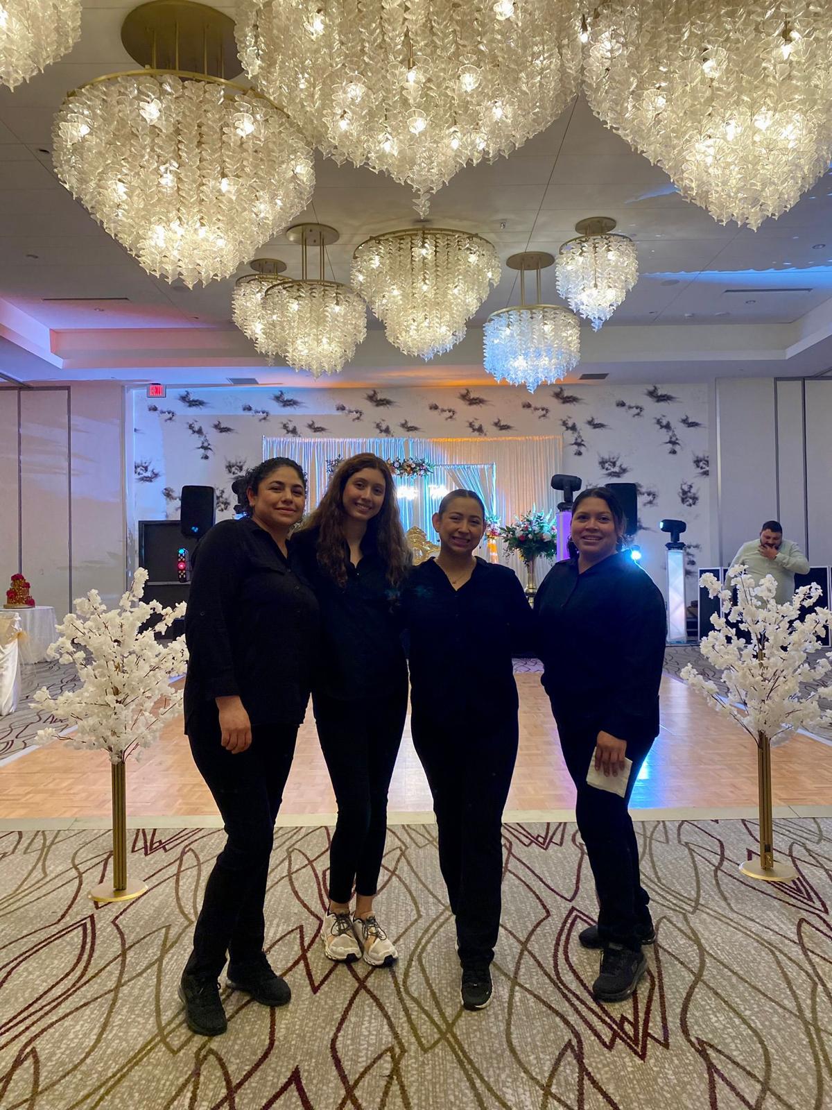 Professional event staff team smiling.